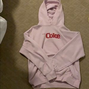 I am selling a pink sweatshirt that says Coke